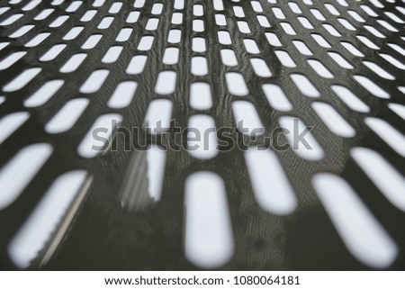 Metallic background with perforation of holes
