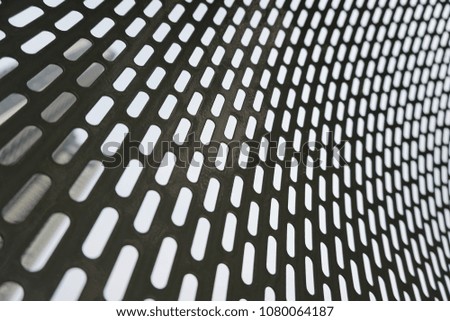 Metallic background with perforation of holes