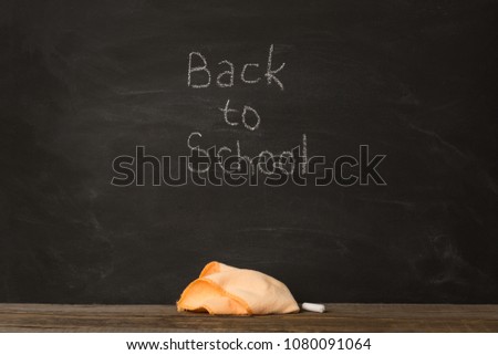 black chalkBoard. chalk and rag lie against. concept: back to school background. text , inscription