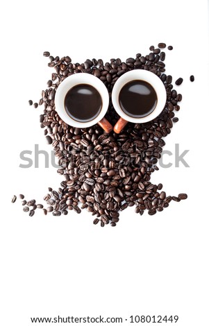 conceptual owl made with coffee beans and cups