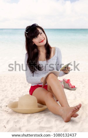 Picture of pretty girl thinking something while enjoying her vacation on the beach