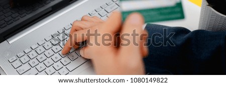 Male arms hold credit card press buttons making transfer closeup. Anti-fraud financial security when entering client discount program number or filling personal credential password login to account