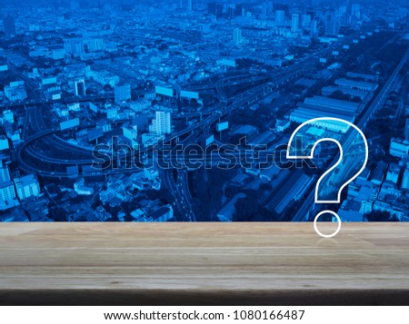 Question mark sign icon over modern city tower, street and expressway, Customer support concept