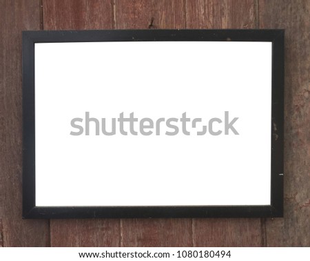 Photo frame isolated on the wooden panel background, empty space for text.