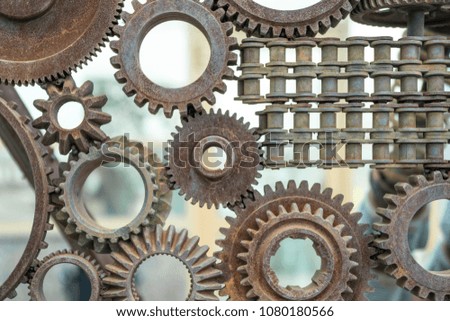 The old gear wheels are assembled into a movement mechanism, the details of the puzzle. Industry, Concept business ideas, strategies, creativity, cooperation, teamwork