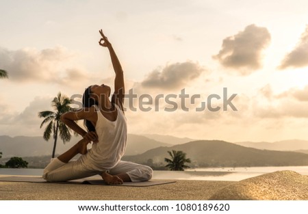 yoga on the rocks Royalty-Free Stock Photo #1080189620