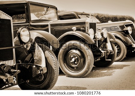 Vintage cars, sepia Royalty-Free Stock Photo #1080201776