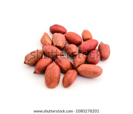 Red peanut peel kernels without peel on white background. Food photo.