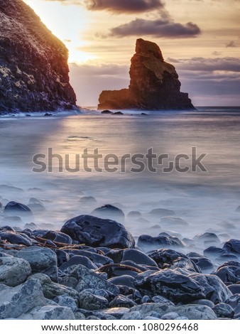 Rocky coast of sea. Slow shutter speed for smooth water level. Visite Talisker Bay on the Isle of Skye in Scotland at sunset