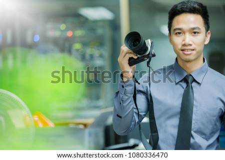 Business man take photo with mirrorless camera.