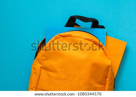 Back to school concept. Backpack with school supplies. Top view. Copy space Royalty-Free Stock Photo #1080344570