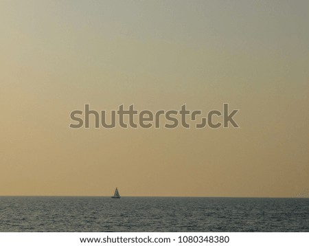 Blurred photo,Beautiful sea and the ship floating in the sea.