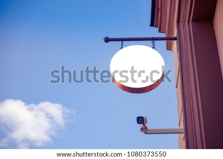 Mock up. Empty round signboard on classical architecture building.