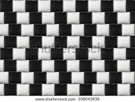 Optical illusion: parallel lines made from black and white pillows