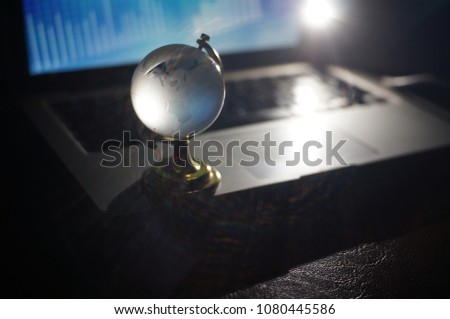 Business network online theme in black background with glass global