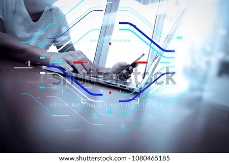 Concept of focus on target with digital diagram.business man hand working on laptop computer on wooden desk as concept, young man student typing on computer sitting at wooden table