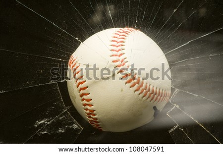 Baseball through broken window.