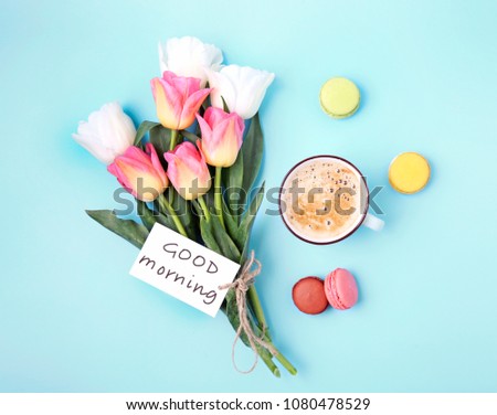 Good morning concept.Flowers,coffee and macaroons top view.