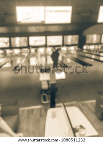 Vintage blurred bowling alley and lounge area at entertainment complex in America