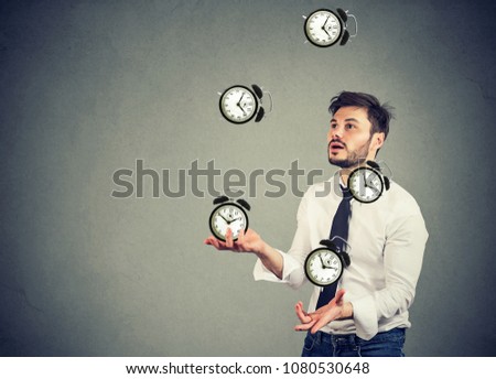 business man successfully juggling managing his time  Royalty-Free Stock Photo #1080530648