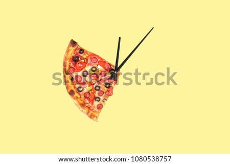 Creative pizza picture in the form of a clock with arrows on a yellow bright background. Concept