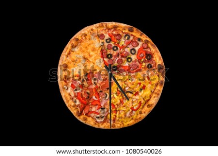 Creative pizza picture in the form of a clock with arrows on black background.  Concept
