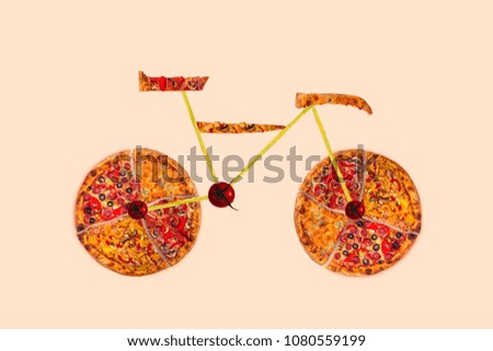 Creative picture of bicycle made of international pizza and vegetables on roses background. Concept