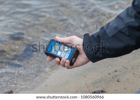 radiation supervisor with geiger counter checks the level of radioactive radiation in the danger zone Royalty-Free Stock Photo #1080560966