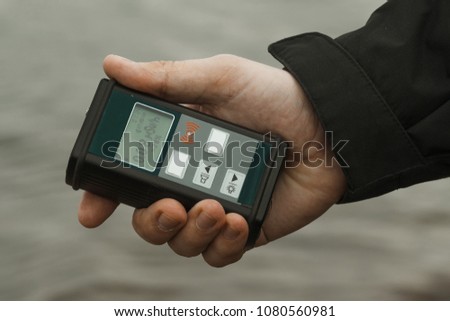 radiation supervisor with geiger counter checks the level of radioactive radiation in the danger zone Royalty-Free Stock Photo #1080560981