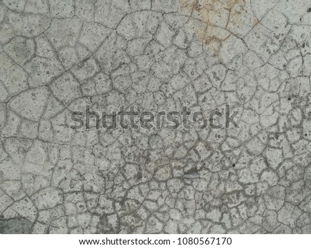 Surface of old polished cement floor is cracked 