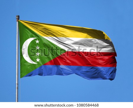 National flag of Comoros on a flagpole