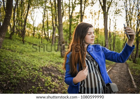 the girl is photographed on the phone