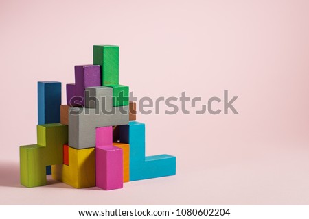 Abstract construction from wooden blocks tetris shapes. The concept of logical thinking, geometric shapes. Royalty-Free Stock Photo #1080602204