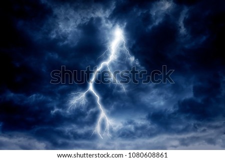Lightning strike on a cloudy dramatic stormy sky.
