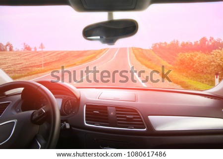 view from salon of car going on road