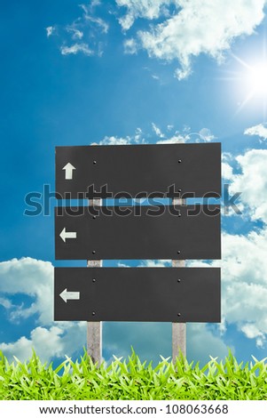 Wooden sign  billboard on the grass isolated on sky cloud background