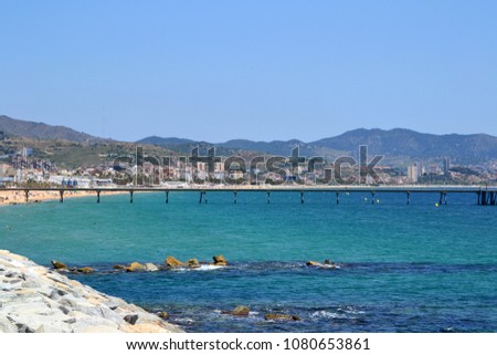 View of Badalona beach and Pont del Petroli, a place for walking over the sea in Badalona, Catalonia - Spain Royalty-Free Stock Photo #1080653861
