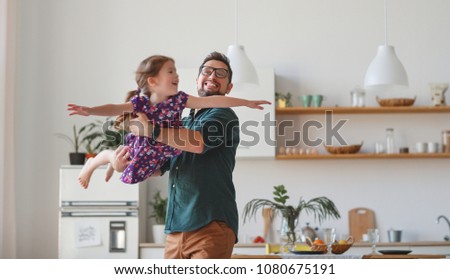 Father's day. Happy family daughter hugs his dad  on holiday
