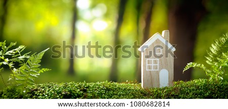 Eco house on moss in forest Royalty-Free Stock Photo #1080682814