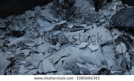 Piles of ash and soot after a fire. Great for textures or backgrounds.
