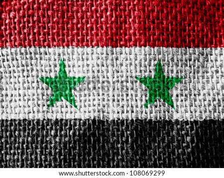 The Syria flag painted on fabric surface