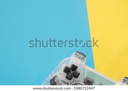 Computer game controll. Gaming concept. Top view of a joystick on colorful background