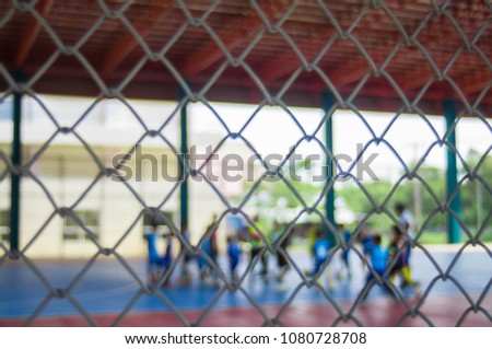 Blurred - Indoor soccer training, for children in the summer, the view through the net, the background blurred. 