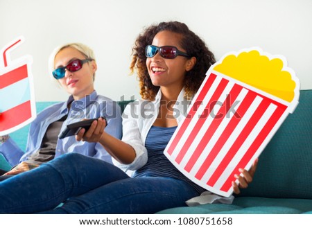 Young women watching three dimensional movie