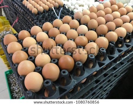 Stack of hen eggs for sale 
