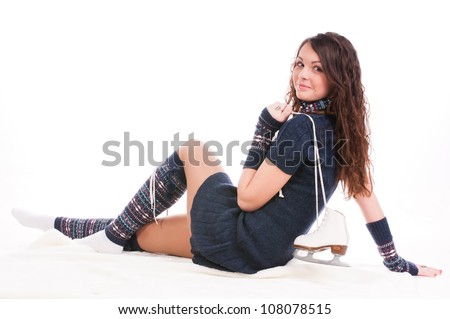 beautifully dressed girl holding ice skates, loves to skate
