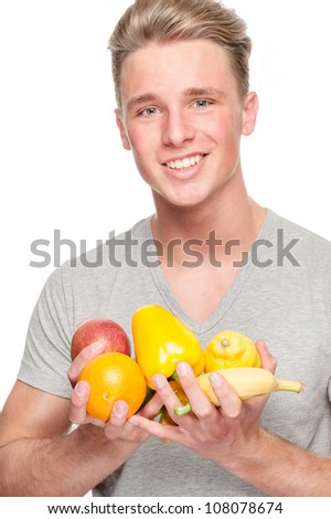 Full isolated studio picture from a happy young man with fruits