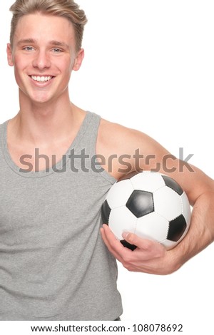 Full isolated studio picture from a happy young man with football