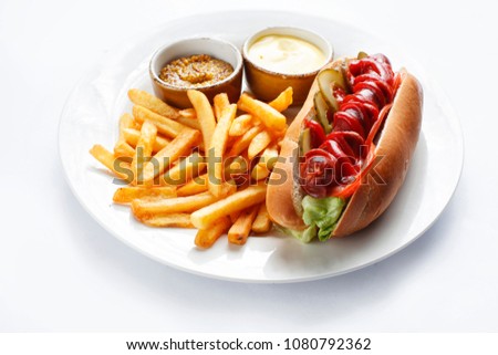 
hot dog and french fries in a plate on a white background Royalty-Free Stock Photo #1080792362