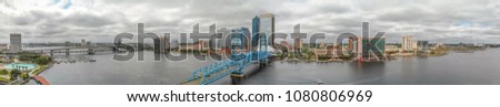 JACKSONVILLE, FL - APRIL 8, 2018: Panoramic aerial city view from the river. The city is a major attraction in Florida.